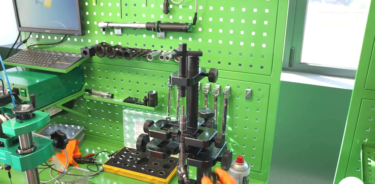 Injector components laid out on the workshop bench